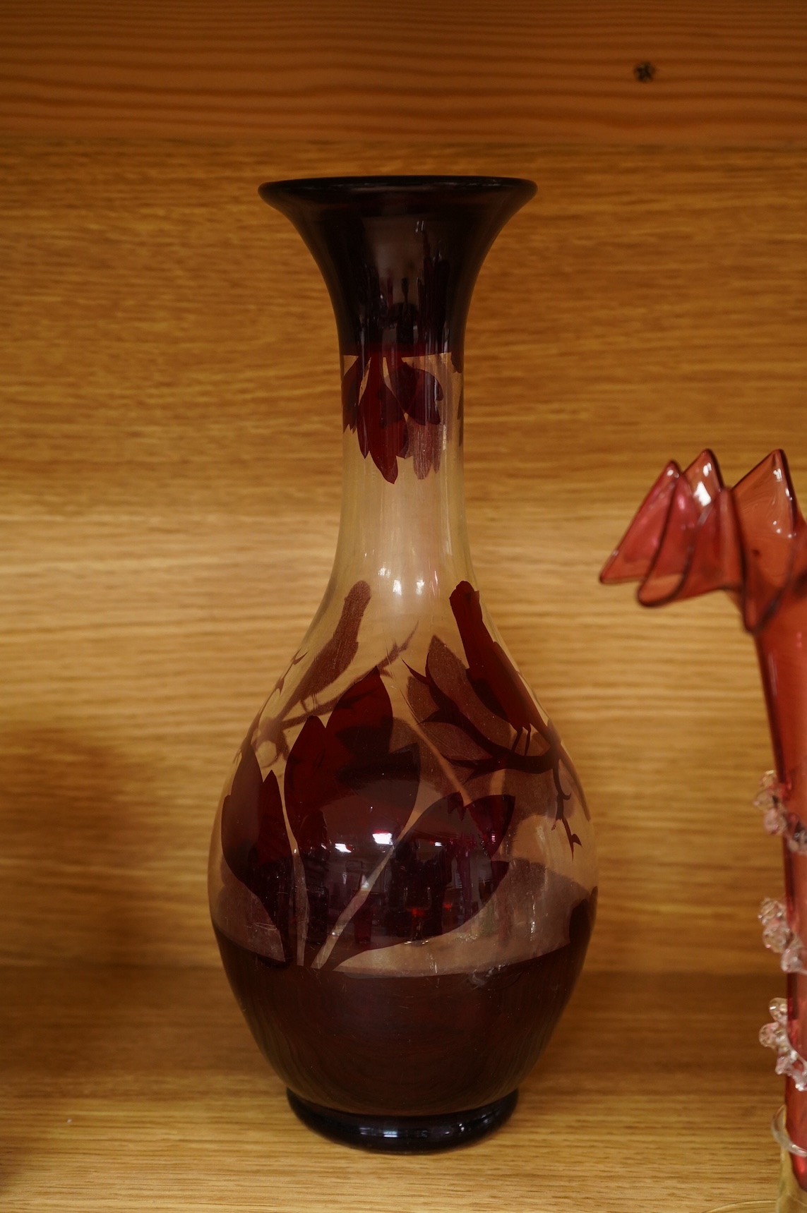 A collection of 19th century and later glassware to include three goblets, a pair of vases with trailed decoration and a Caithness glass vase, largest 28cm high